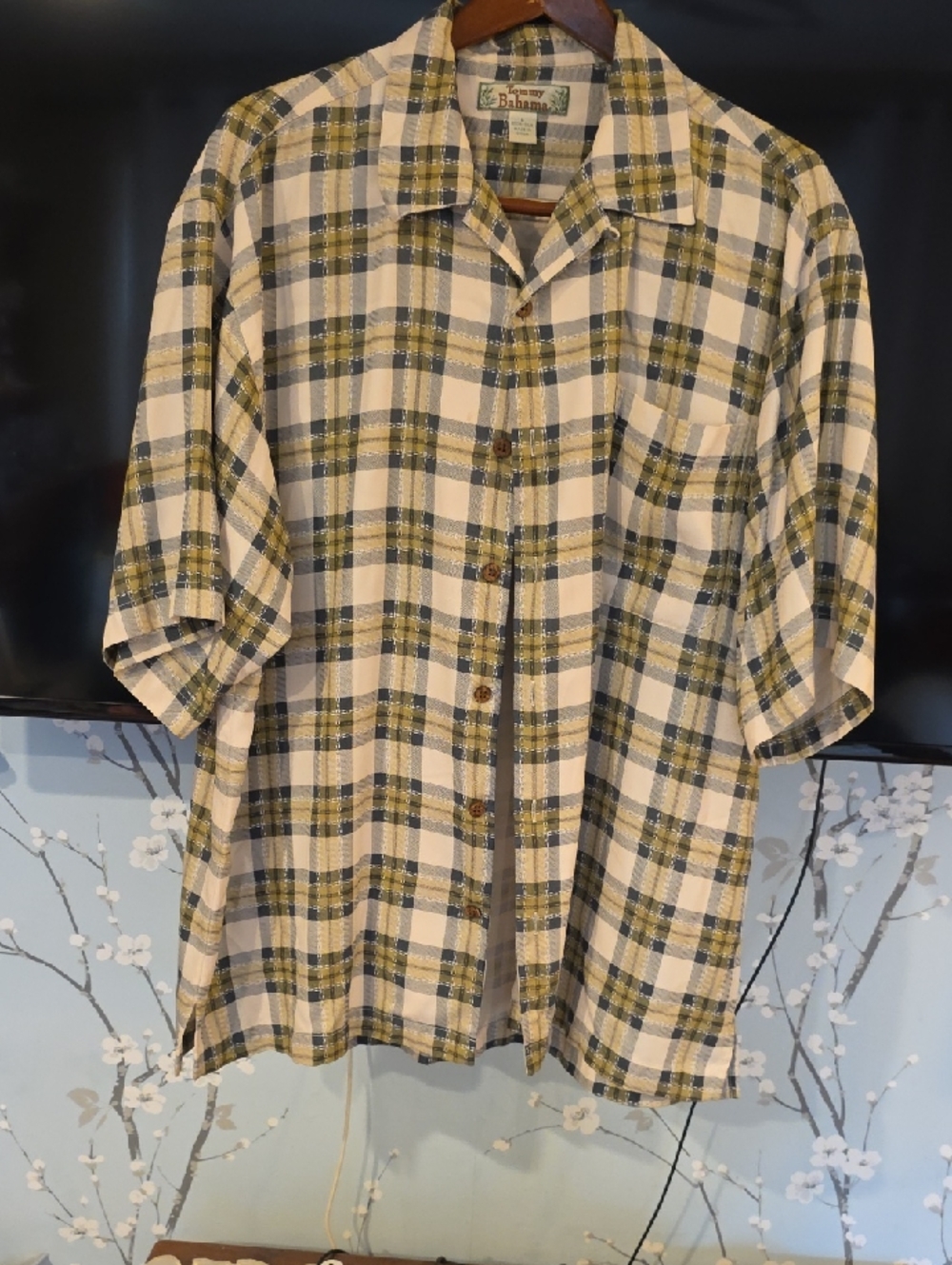 One hundred percent silk Short sleeved, tommy bahama shirt in size large